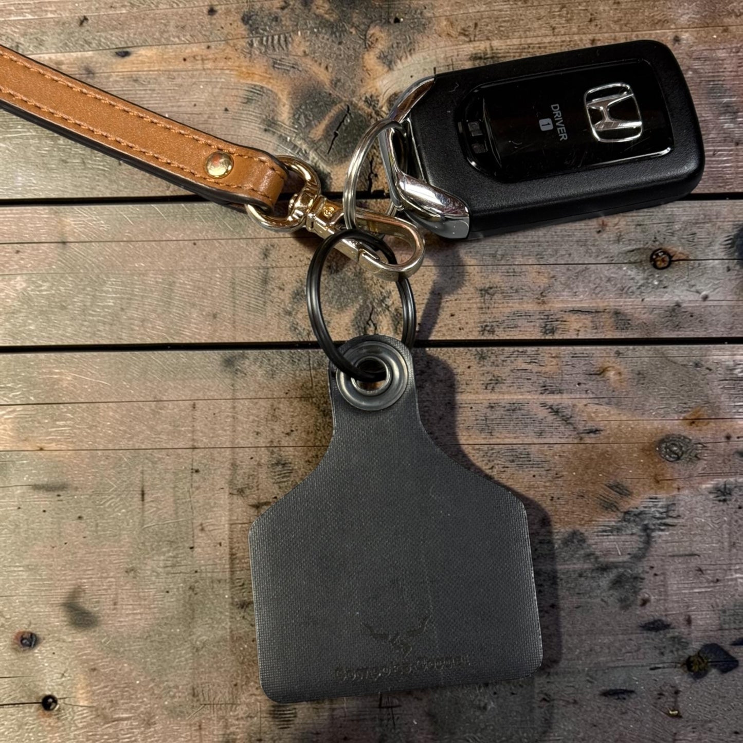 SHIT'LL BUFF CATTLE TAG KEYCHAIN